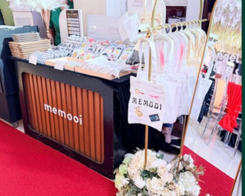 Studio setup with red carpet and florals