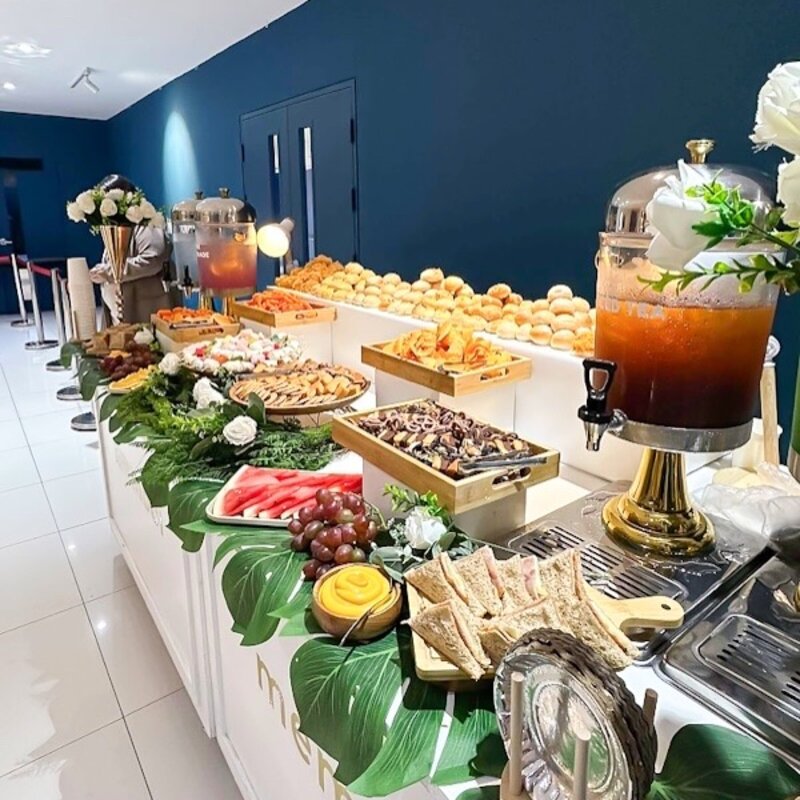 Cocktail spread against a blue accent wall