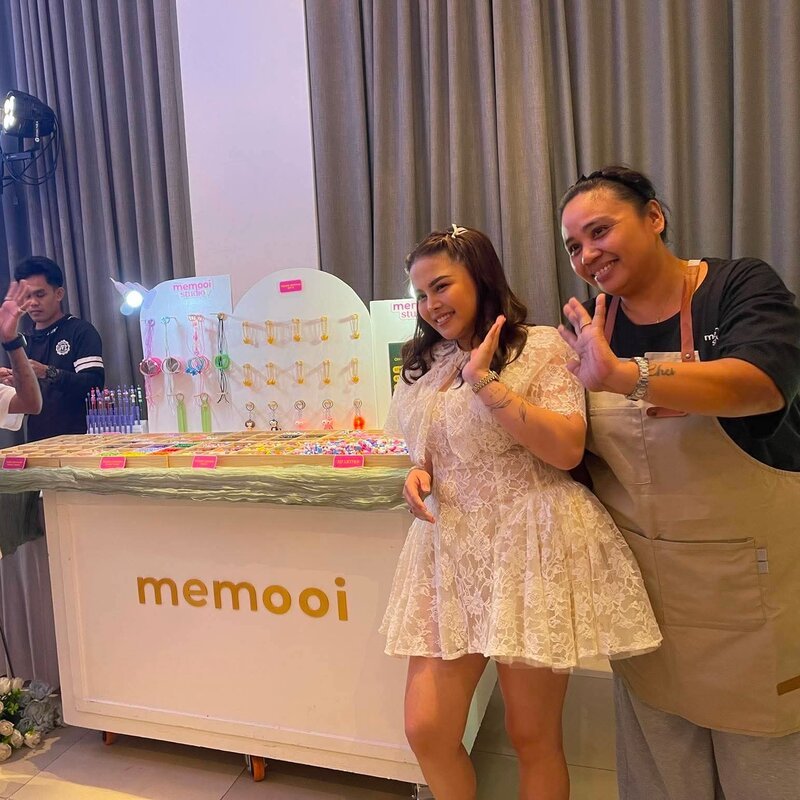 Memooi team celebrating at an event