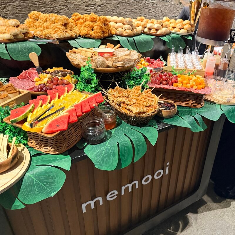 Waffle and charcuterie spread with blue backdrop